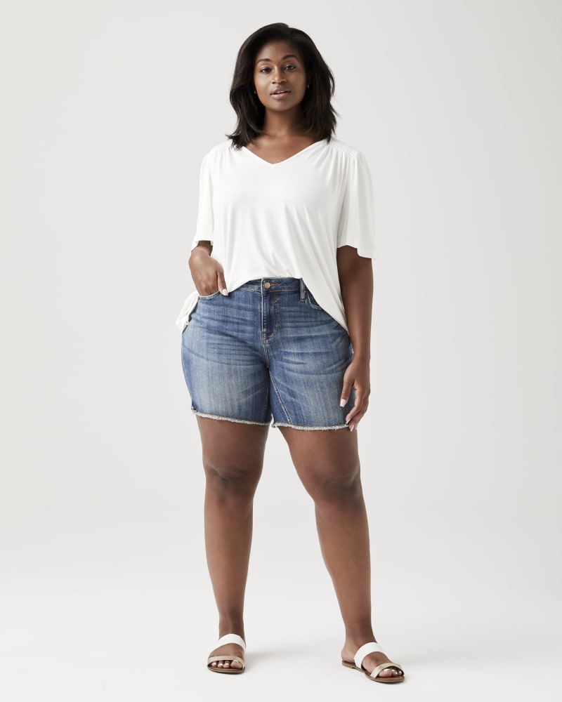 Plus size model wearing Lana Frayed-Hem Denim Shorts by Vigoss | Dia&Co | dia_product_style_image_id:131562
